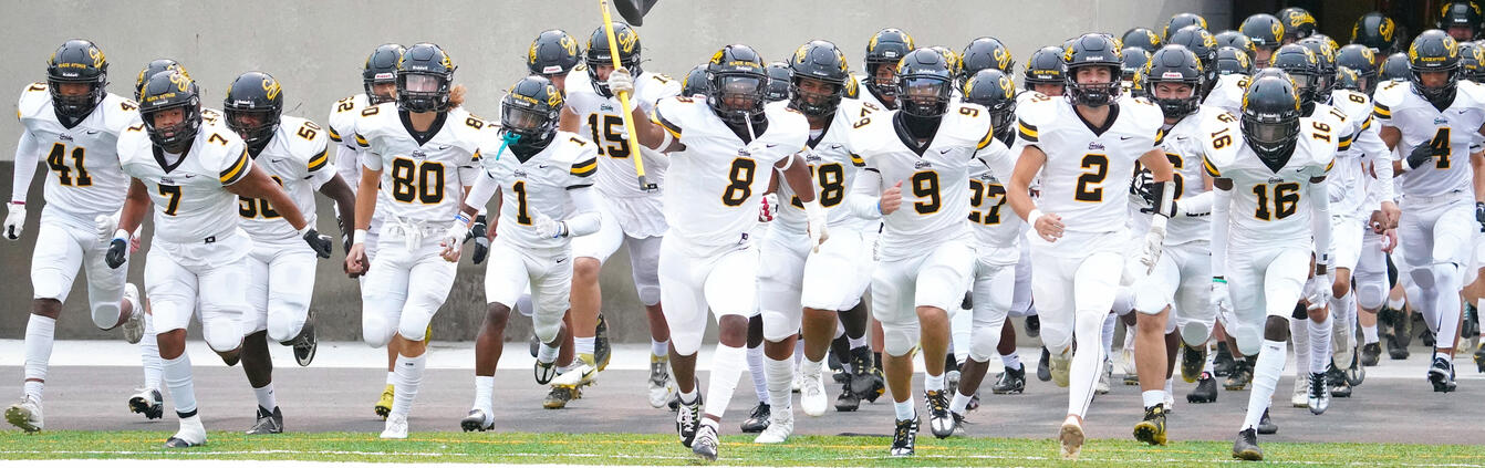 Fort Wayne Snider Panther American Football team runs out onto the Spuller Stadium field as visitors on the campus of Northrop High School.